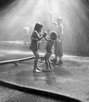 Children playing in sprinkler